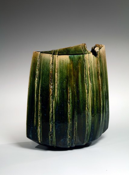 Large tall Oribe vessel in ovoid form with pinched edges and carved vertical faceted bands on sides and top&nbsp;, Stoneware with Oribe glaze&nbsp;