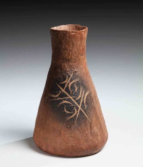 Beaker-shaped ash-glazed vessel with abstract bird design