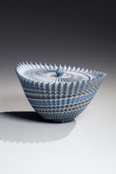 Ogata Kamio&nbsp;(b. 1949), Covered, blue, gray and white neriage (marbleized) mizusashi (water jar) with carved, pleated surface and upraised pointed edge surrounding the mouth