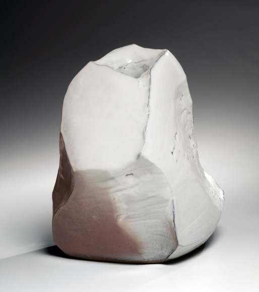 Kaneta Masanao (b. 1953), Rock-like, scooped-out standing vessel with multi-plane body, unctuous Hagi glaze and kiln effects
