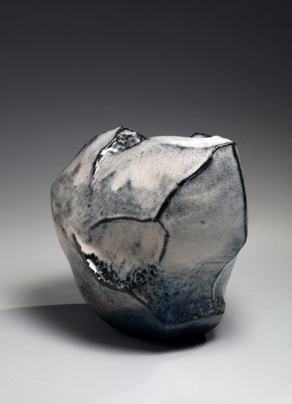 Kaneta Masanao (b. 1953), Rock-like, scooped-out standing vessel with unctuous Hagi and and natural ash glazes and extensive kiln effects
