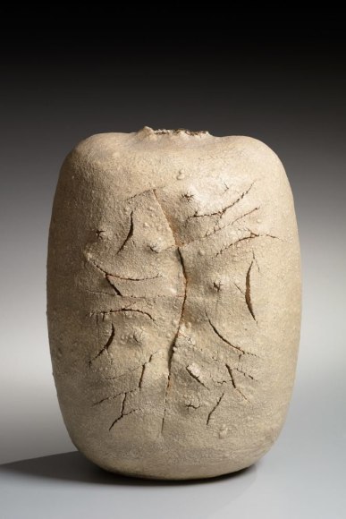 Rounded sculptural vessel-form with incised, cracked front and torn mouth