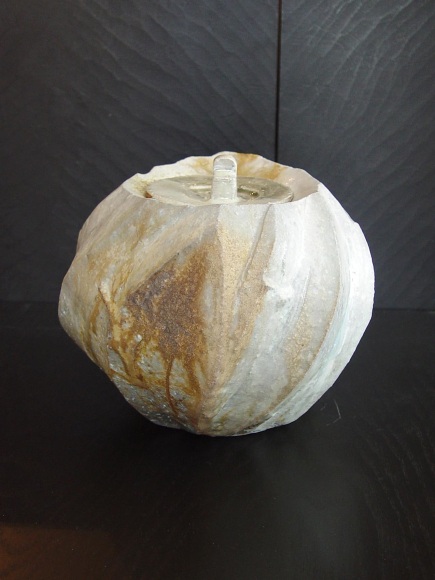 Round covered Tanba water storage jar with ash glaze covering diagonal banding; 2011