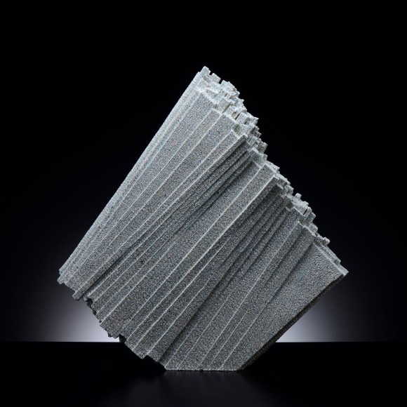 Thinly walled standing sculpture with diagonally layered triangular planes with color-slip inlays, 2016