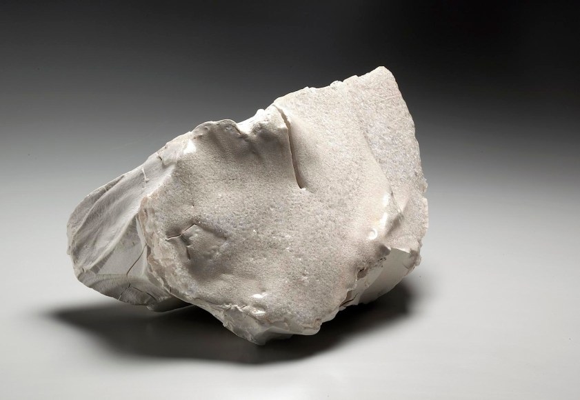 Horizontal, rock-shaped sculpture with applied translucent crystalized glass