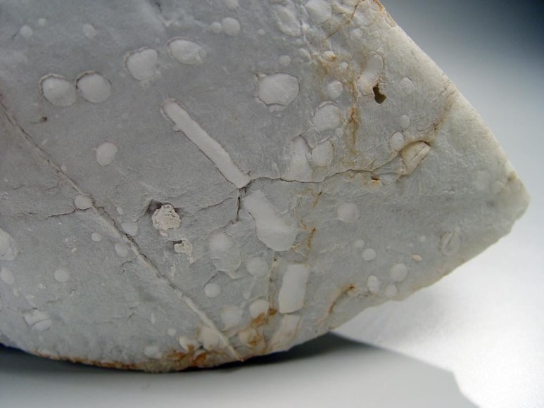 Abstract sculptural form that has been &ldquo;excavated&rdquo; from a larger form with molten glaze in pale green, molten exterior and rough powdery glazed interior, ca.2000-2005