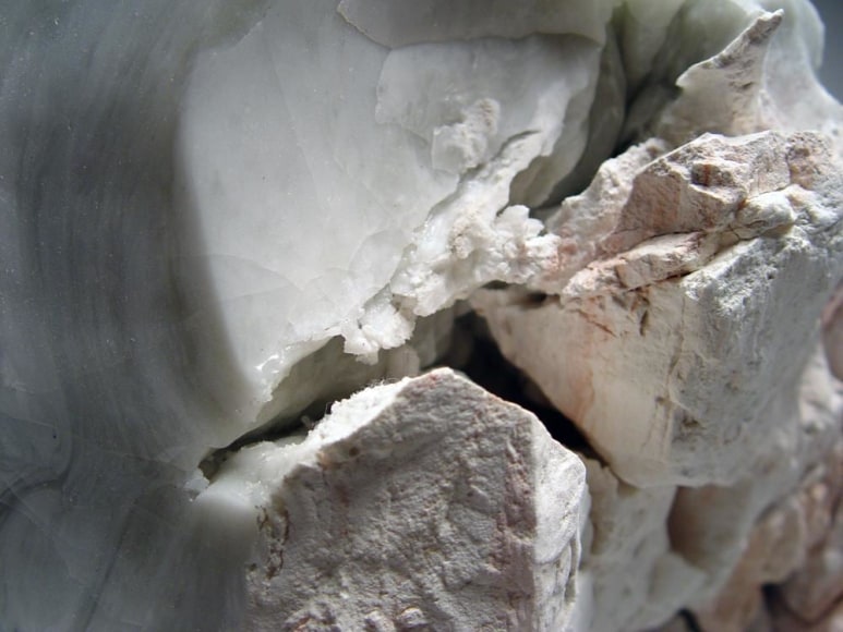 Standing abstract sculptural form that has been &ldquo;excavated&rdquo; from a larger form with molten glaze in pale green and smooth molten back; jagged mouth-like interior with embedded pre-fired porcelain; ca. 2000-2005