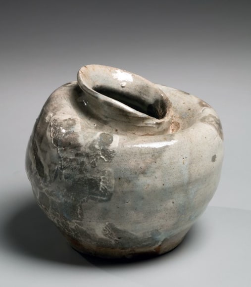 Slumped vessel (tsubo) with thin white-slip glaze and impressed finger patterning