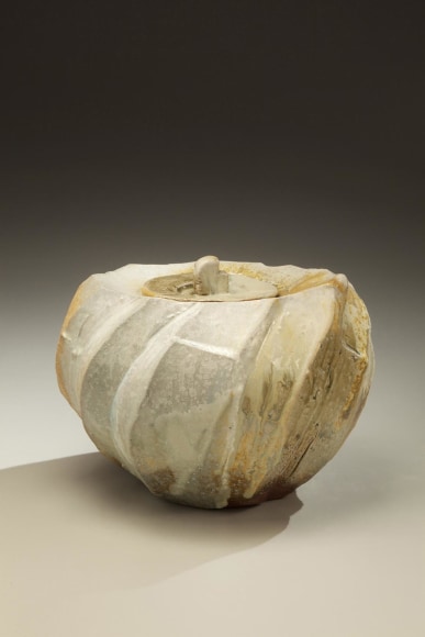 Round covered Tanba water storage jar with ash glaze covering diagonal banding; 2011