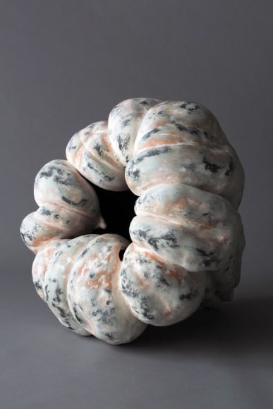 Sculpture in the form of a pumpkin with matte glazes in pink, white and black