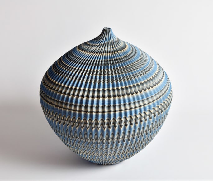 Ogata Kamio (b. 1949), Neriage&nbsp;(marbleized) vessel with a carved, ridged&nbsp;surface, sloped shoulder, tapered base, short neck and small round mouth
