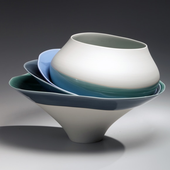 Two shallow and one rounded bowls unevenly set within a deep, narrow-footed vessel, 2013