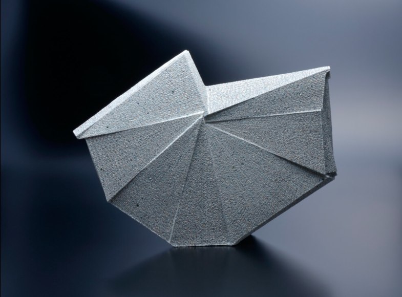 Large horizontal multi-faceted sculpture with revolving planes around a central focus, 2012