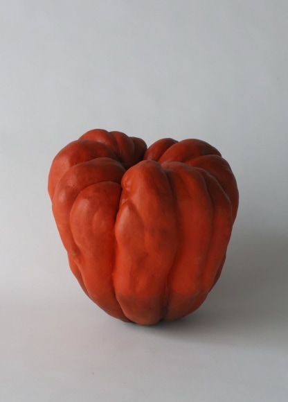 Sculpture in the form of a pumpkin with matte glazes in red and black