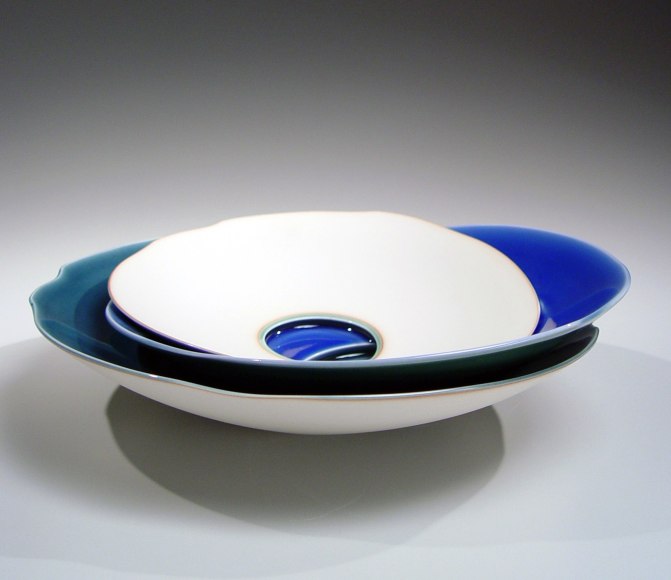 Small shallow triple-stacked form of three blue-glazed bowls set unevenly, 2012