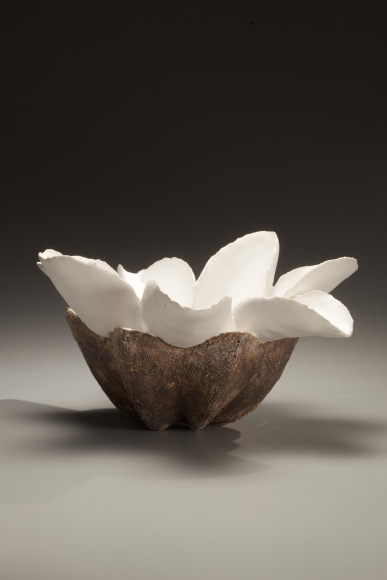 Low flower-shaped vessel with six white petals and brown textured base, 2008