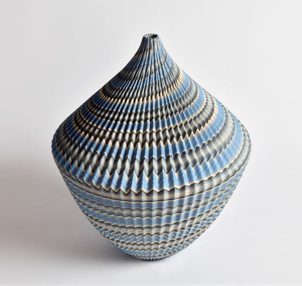 Ogata Kamio (b. 1949), Top-like&nbsp;neriage&nbsp;(marbleized) vessel with carved, ridged surface, sloped shoulder, tapered base, narrow neck and small mouth