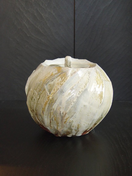 Round covered Tanba water storage jar with ash glaze covering diagonal banding; 2011