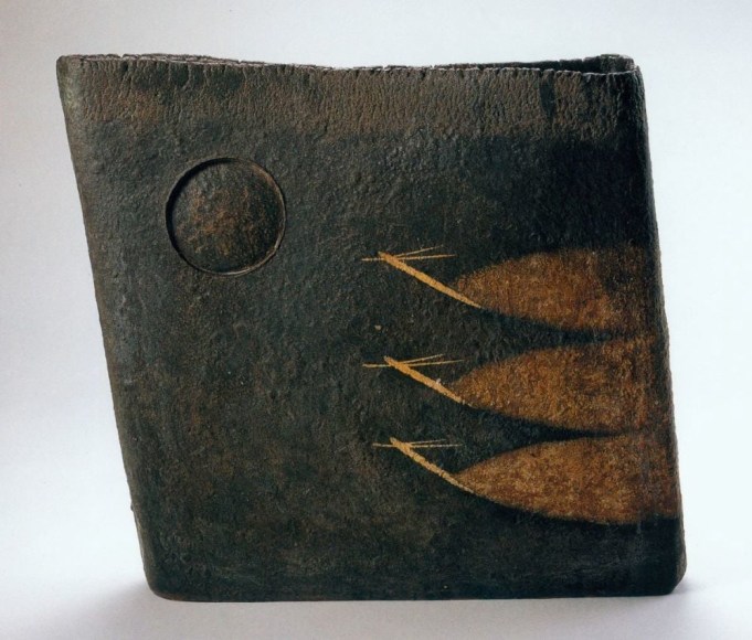 Large slab-built rectangular black-glazed vessel with landscape scene of recessed moon with birds in flight