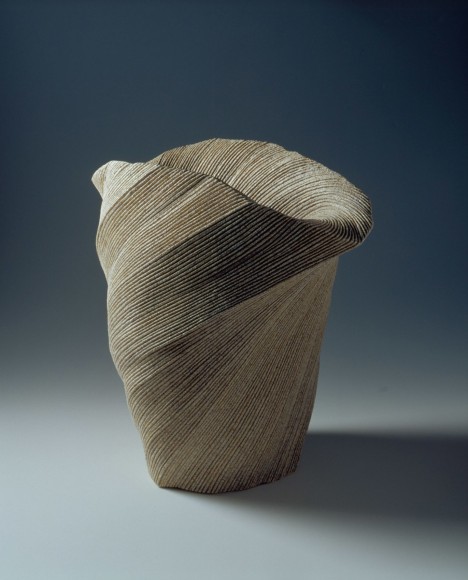 Large, undulating vessel with large mouth and diagonally incised cascading folds