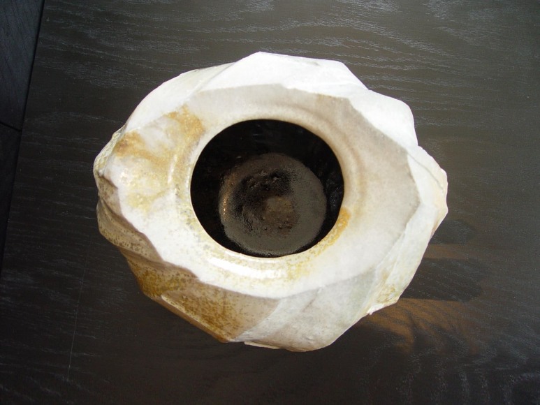 Round covered Tanba water storage jar with ash glaze covering diagonal banding; 2011