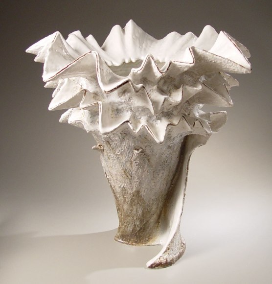 Large, vibrant vessel with deep blue interior and creamy white and brown glazes, 1995