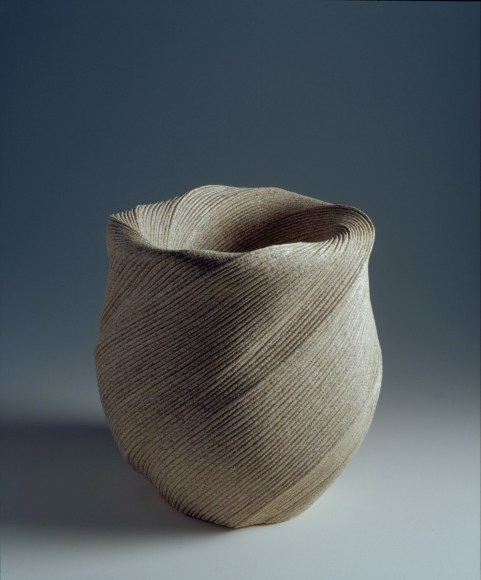 Undulating vessel with diagonally incised cascading folds