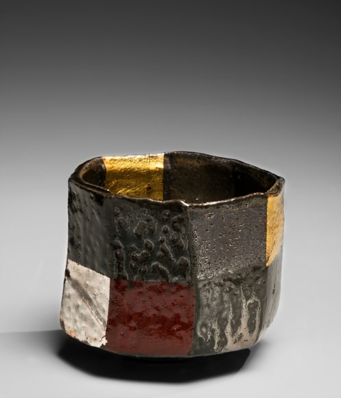 Octagonal faceted teabowl with checker-board pattern, polychrome salt glazing and gold and silver-leaf