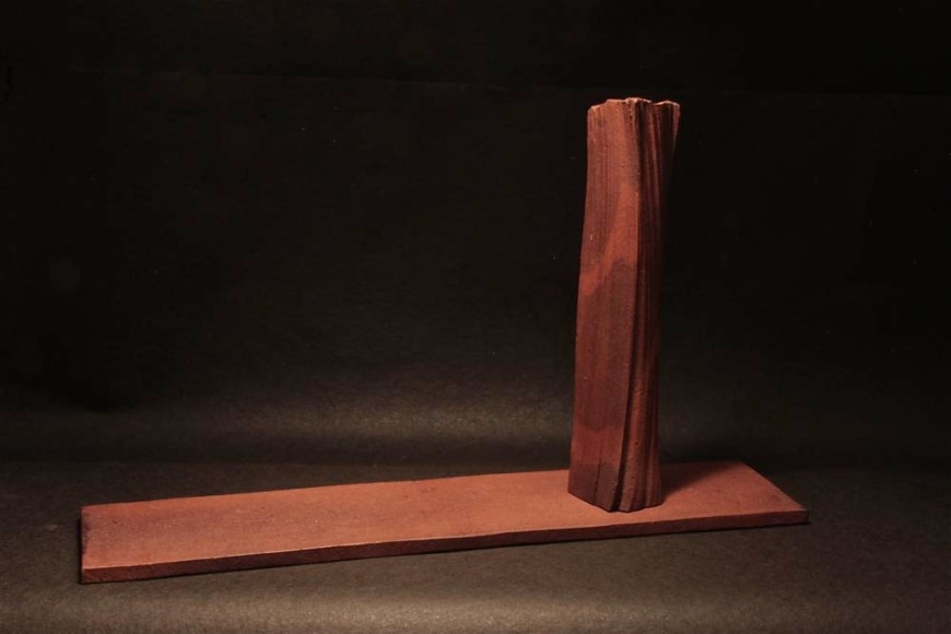 Rectangular sculpted vessel rests on a flat base, titled TAIRAGI +, 2012