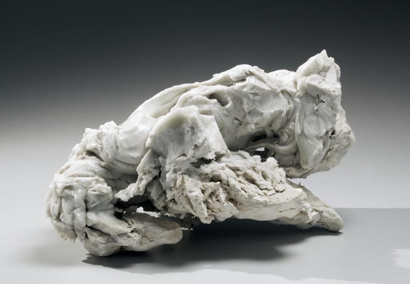 Abstract sculptural form that has been &ldquo;excavated&rdquo; from a larger form with molten glaze in pale green, ca. 2000-2005