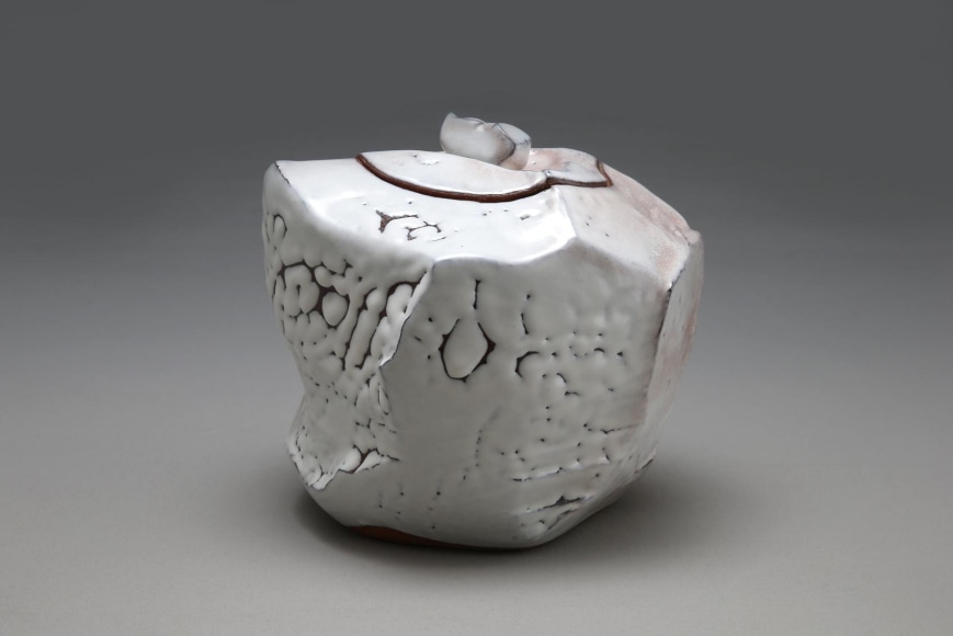 Sculpted covered waterjar with faceted sides, covered with crawling Hagi white glaze (kairagi) with pink tones, and kiln effects, 2013