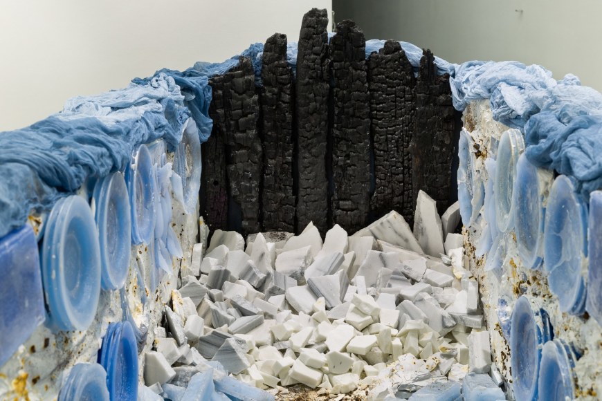 A close-up of a mixed media floor installation