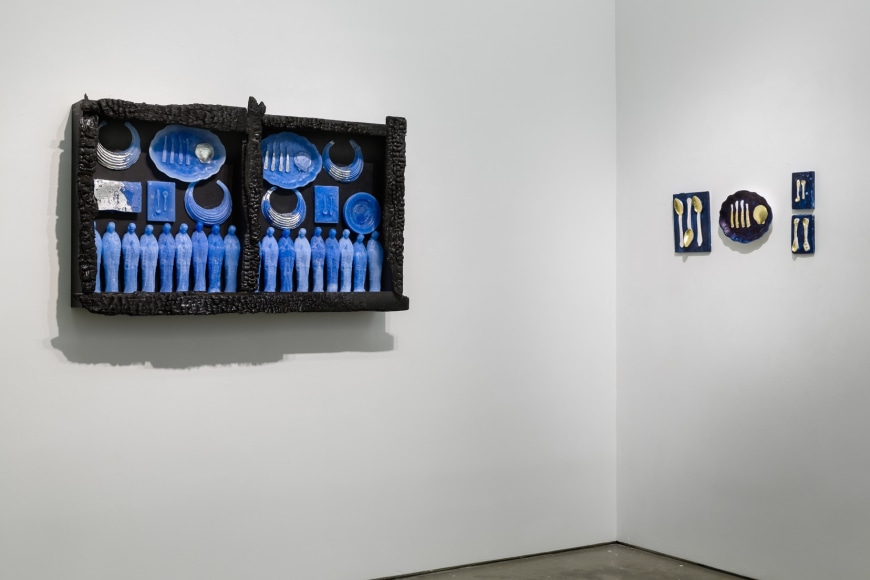 Mixed media pieces line the walls