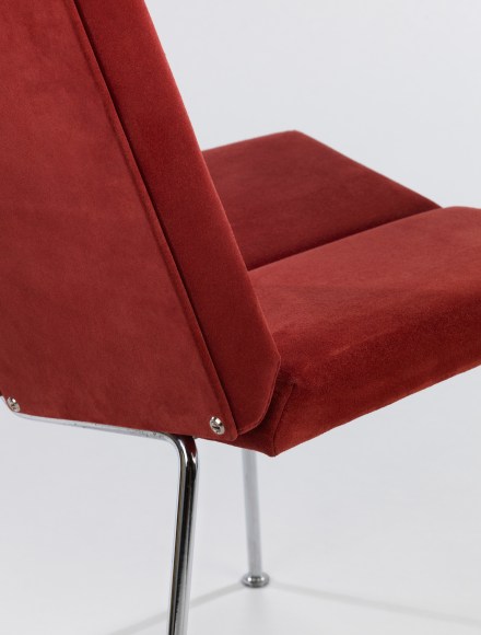 Single chair in red suede made by Pierre Guariche detail shot of back.