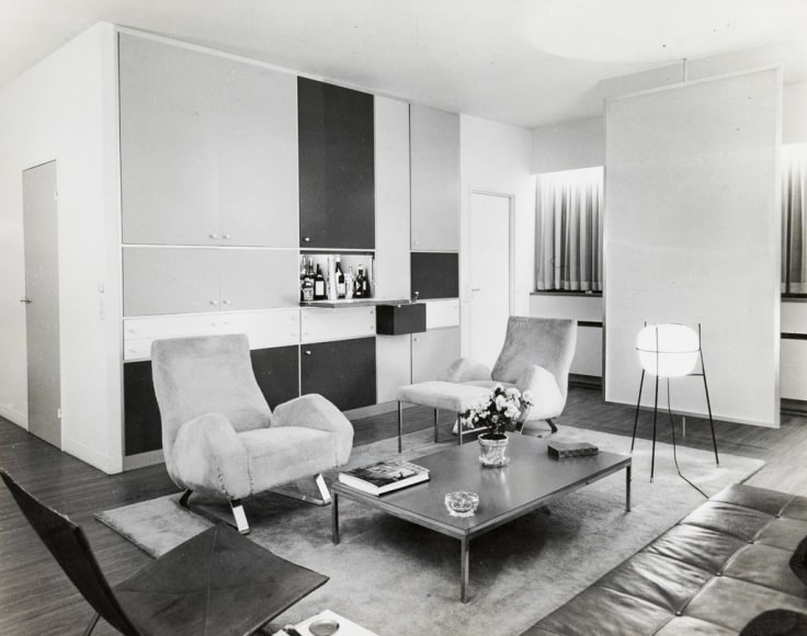 Black and white archival image of the chair made by Dumond shown in his own apartment.