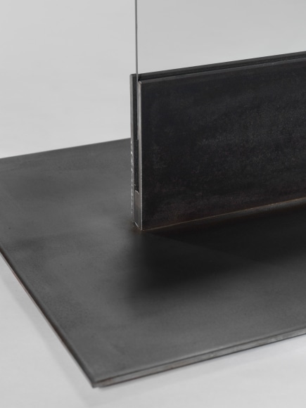 photos of a glass panel with a steel base