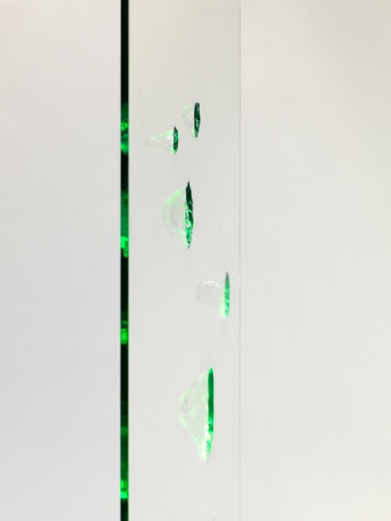 photos of a glass panel with a steel base