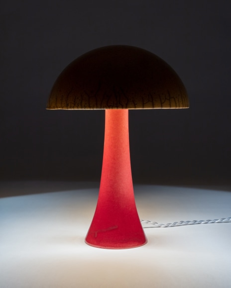 Illuminated lamp with orange raku glazed shade and red raku glazed base