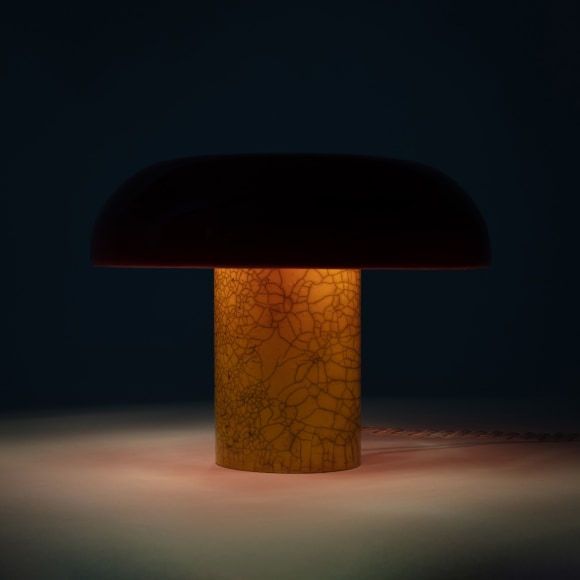 Illuminated lamp with red raku glazed shade and yellow raku glazed base
