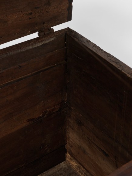 picture of a medieval trunk in a gray room