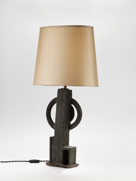 photograph of a geometric lamp in an empty room