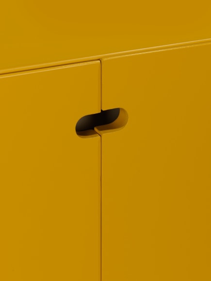 photograph of a yellow cabinet in a blank room