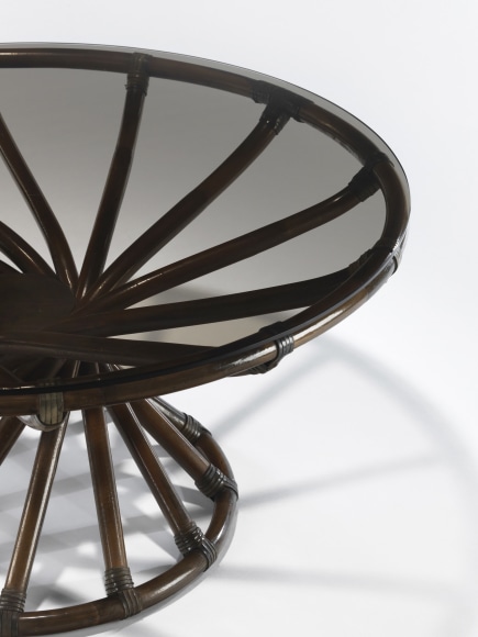 Glass topped rattan low table by Bernard Govin