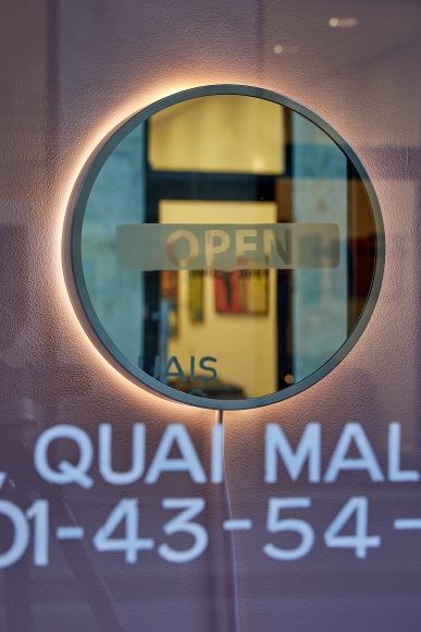 artist's installation of a mirror in a storefront