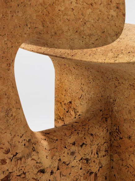 cork chair with great curves by made in situ. Image with grey background.