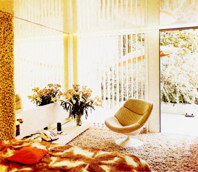 Archival photo of a living room featuring Guariche's Low Table, 1960s