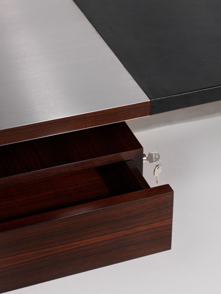 Detail view of wooden drawer and steel desktop