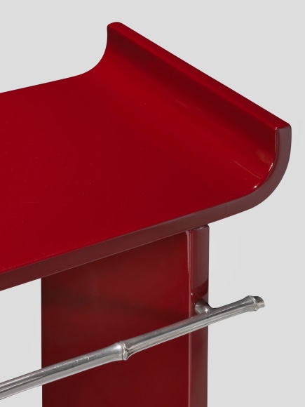 Red lacquer console table by Maria Pergay with image from the close up.
