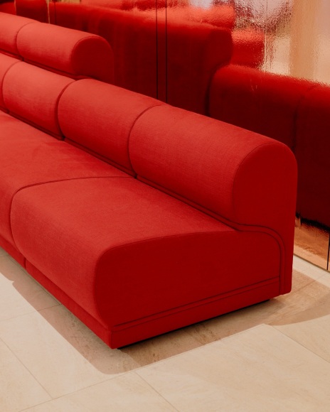 View of Paulin hotel de Ville sofa in the gallery. red upholstery in 10 sections.