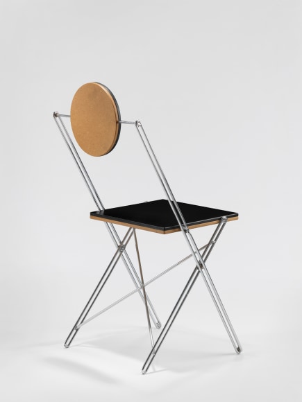 Black lacquered chair with tubular steel leg frame